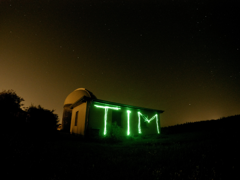 Painting my name with light in a long exposure.