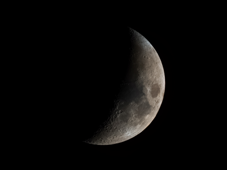 A crescent of the moon from north-north-east to south-south-west.